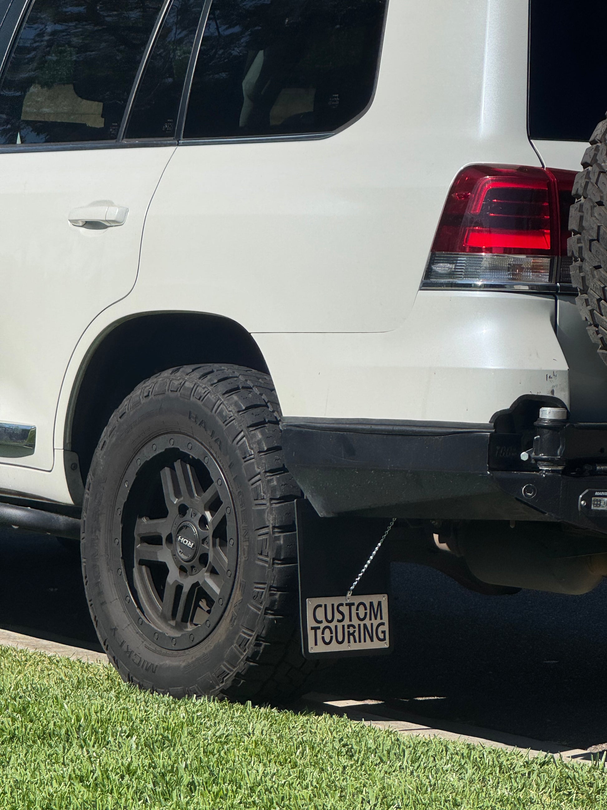 Custom mudflap with chain